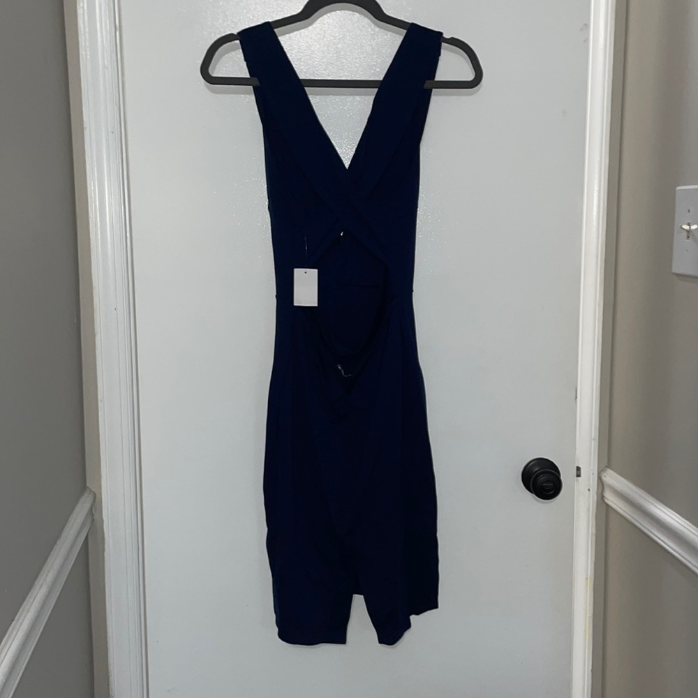 Charlotte Russe (L) navy blue plunge v neck with cross back.